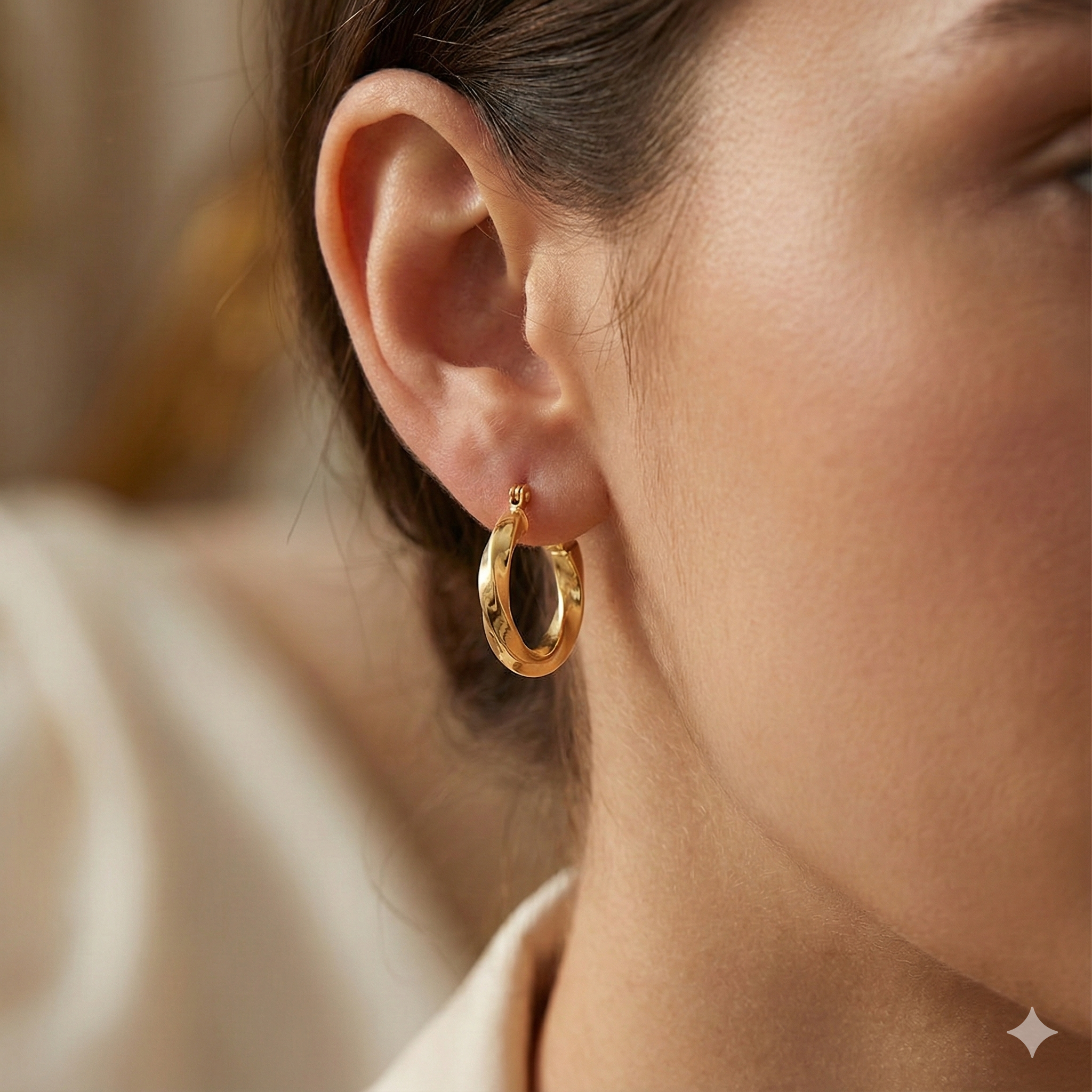 Feralyne Yellow Gold Twisted loop Earrings